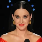 Katy Perry Gets Fiery Red in Corset, Feathers and Slit Skirt on ‘American Idol’